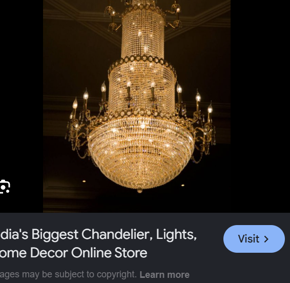 Grand multi-tiered crystal chandelier in luxury space